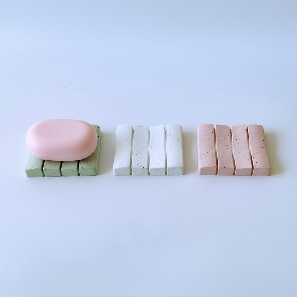 Soap dishes with pink soap bar on sage green